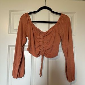 Cropped orange, long sleeve shirt